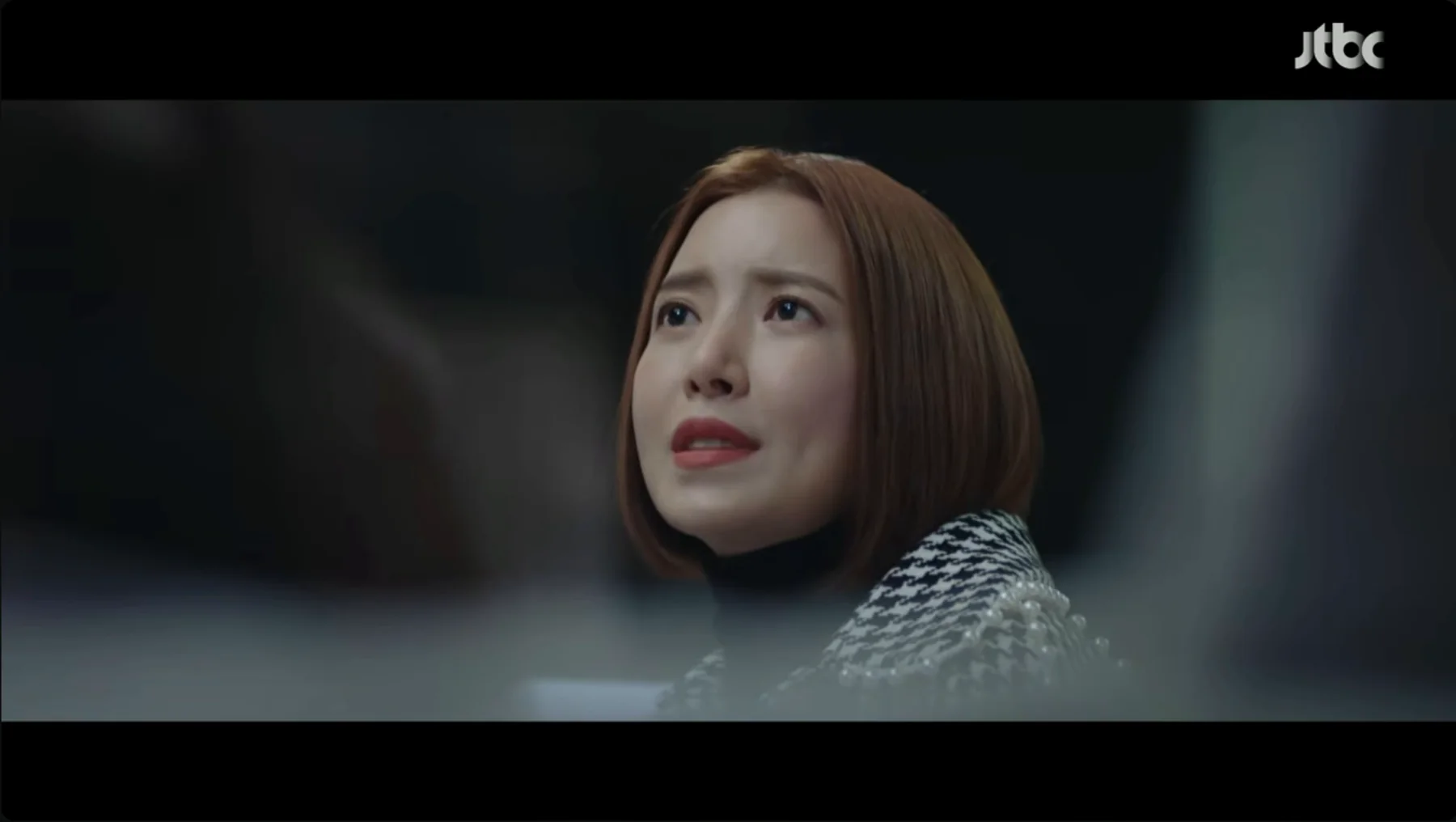 On the TV, the video (a Korean clip).